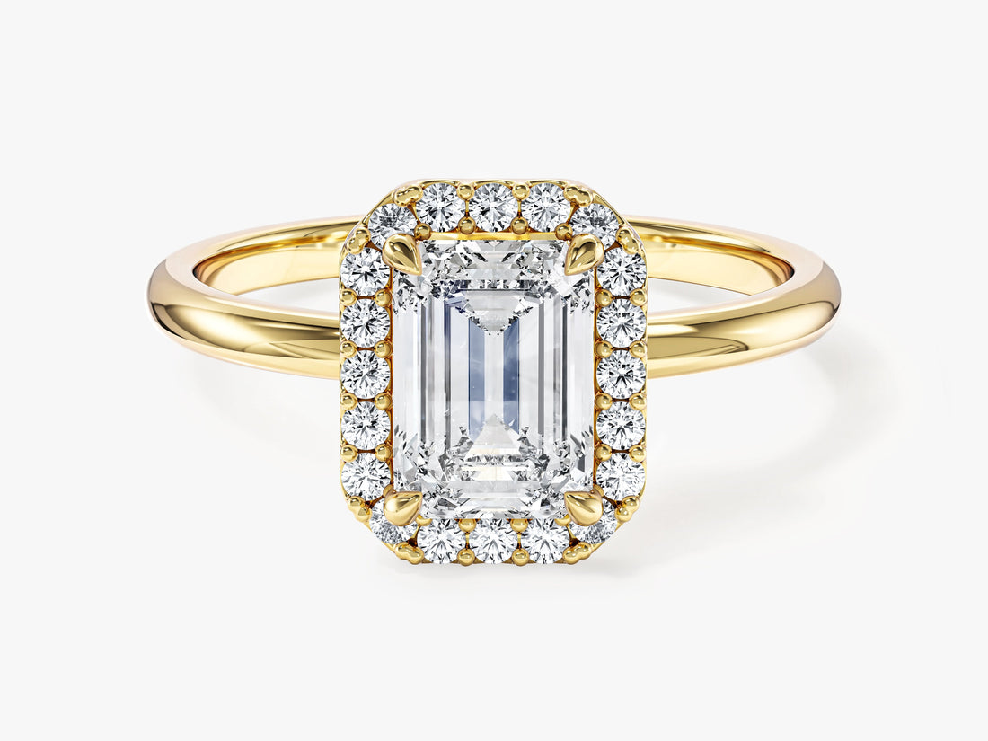 Emerald cut moissanite halo engagement ring with plain band in yellow gold, front view