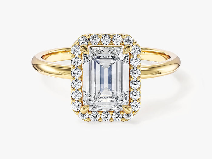 Rectangle emerald moissanite halo engagement ring with petal corner claws in yellow gold