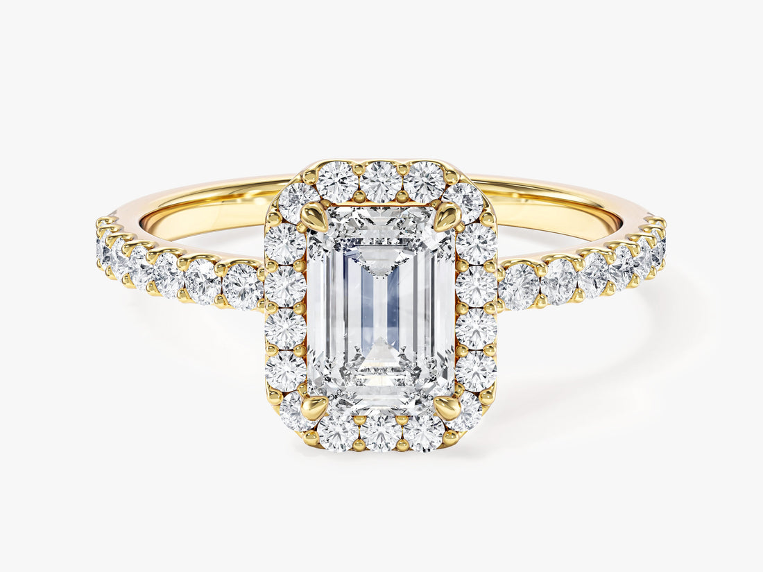 Emerald moissanite rectangle halo engagement ring with corner claws and pave shank in 14K yellow gold, front view