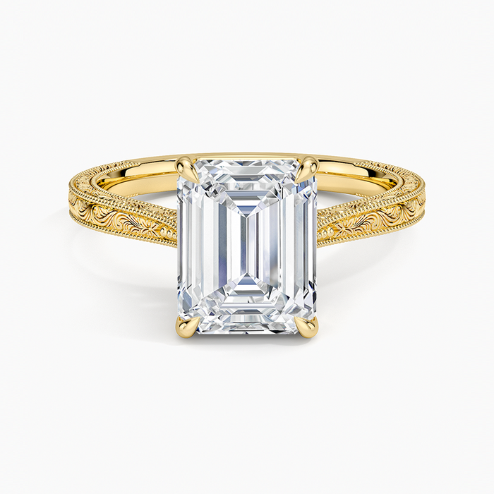 Emerald cut moissanite vintage hand engraved milgrain solitaire ring in yellow gold, top view