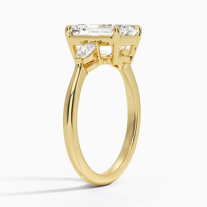 Side profile showing the low set pear side stones and slim band