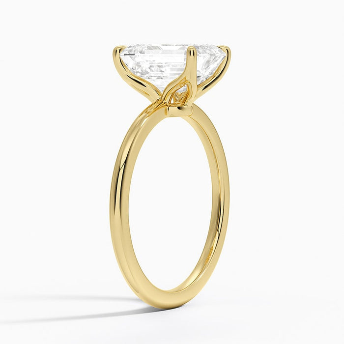 Side profile showing the open basket and scrolled gallery of the solitaire setting