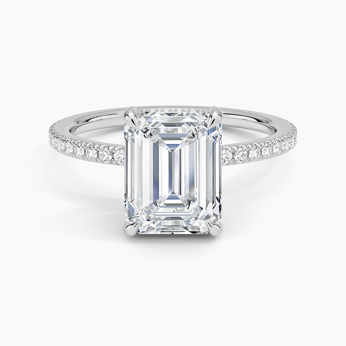 Emerald cut moissanite hidden halo micro pave engagement ring in white gold, top view