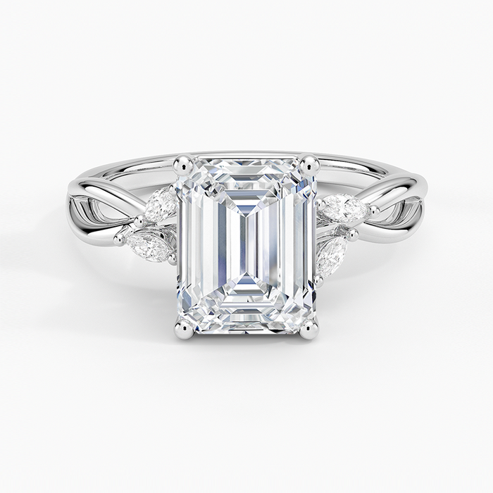 Emerald cut moissanite braided vine engagement ring with marquise and round accents in white gold, top view