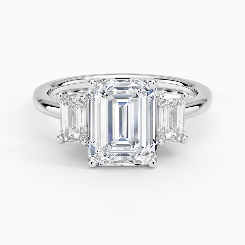 Emerald cut moissanite three stone engagement ring with emerald cut sides in white gold, top view