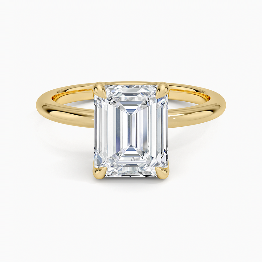 Emerald cut moissanite tulip basket solitaire engagement ring in yellow gold, top view