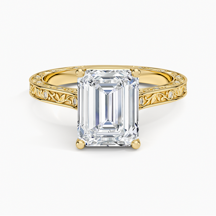 Emerald cut moissanite engraved vine ring with flush set accents in yellow gold, top view