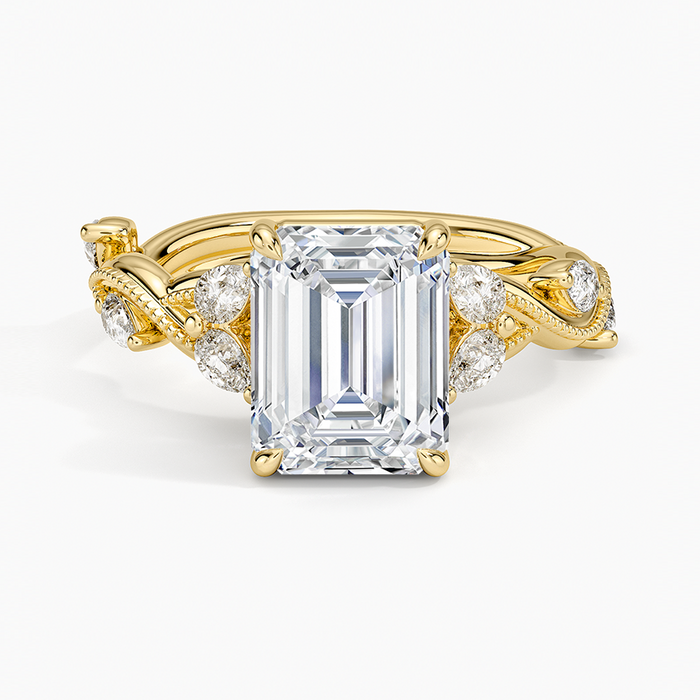 Emerald cut moissanite sculpted leaf vine ring with marquise accents in yellow gold, top view