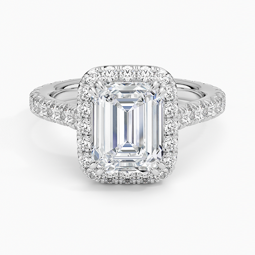 Emerald cut moissanite halo ring with three quarter pave band in white gold, top view