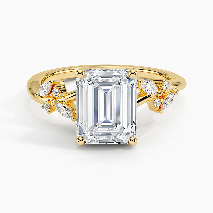 Emerald cut moissanite ring with scattered marquise petal accents in yellow gold, top view