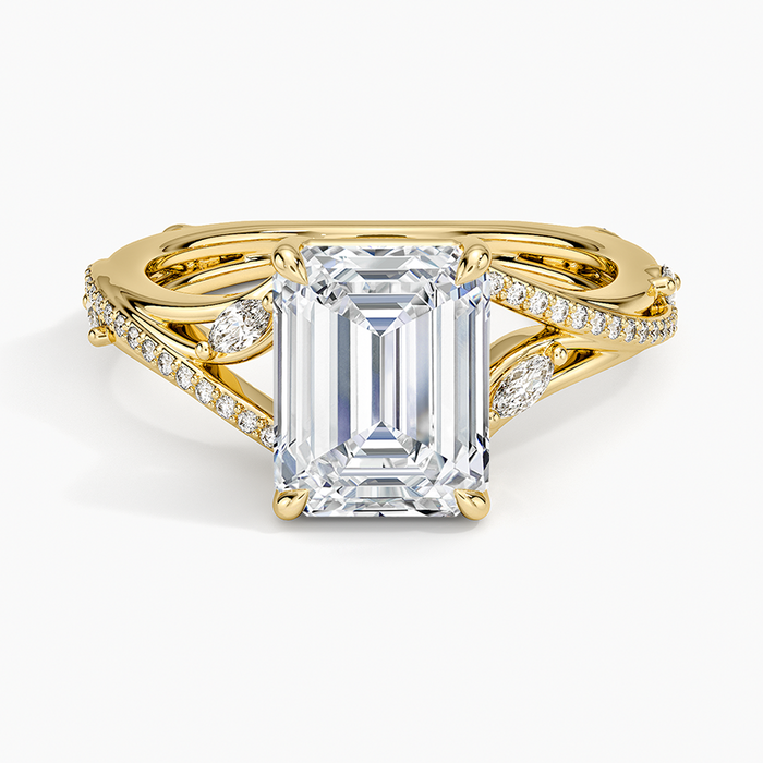 Emerald cut moissanite crossover split shank ring with marquise and pave in yellow gold, top view