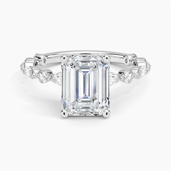 Emerald cut moissanite ring with alternating marquise and round accents in white gold, top view