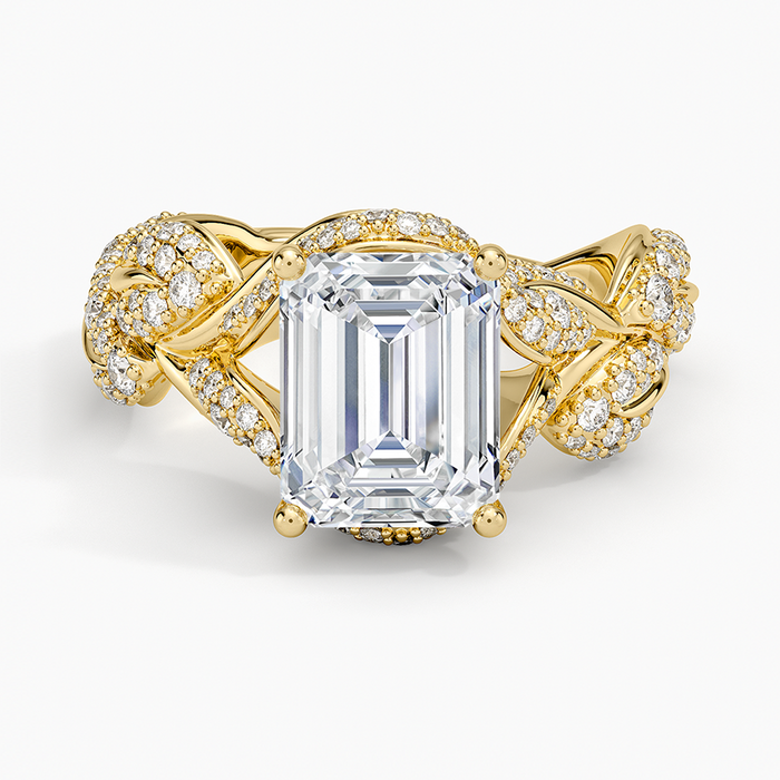 Emerald cut moissanite woven braided pave ring with hidden halo in yellow gold, top view