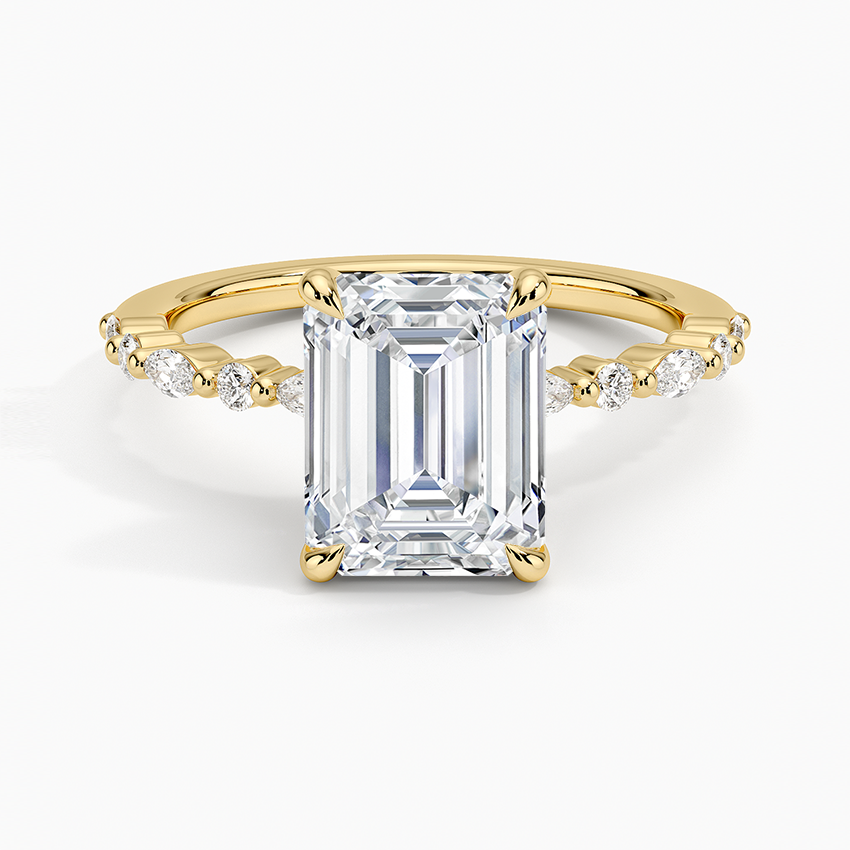 Emerald cut moissanite petite ring with alternating marquise and round accents in yellow gold, top view