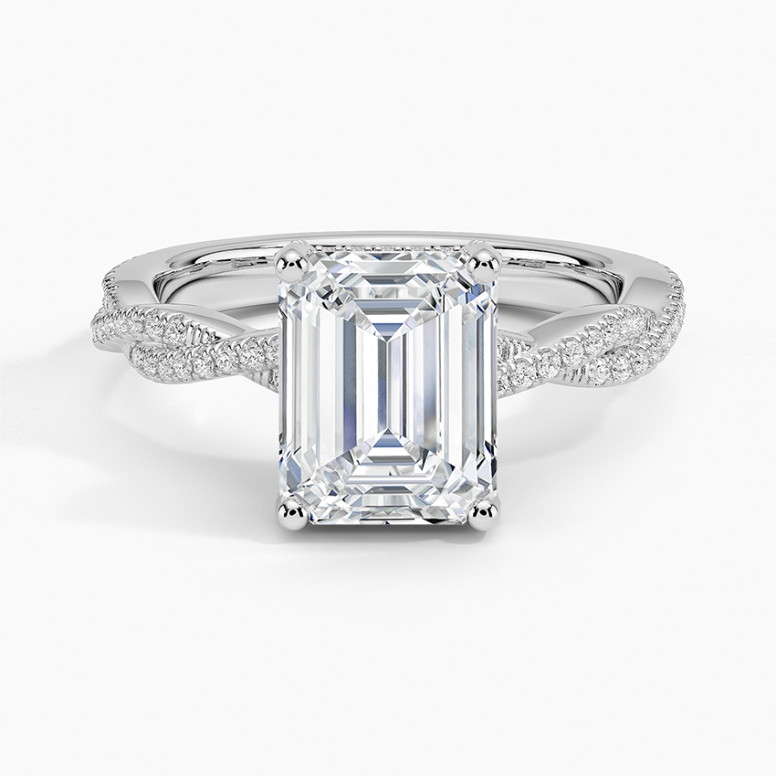 Emerald cut moissanite hidden halo ring with pave twist shank in white gold, top view