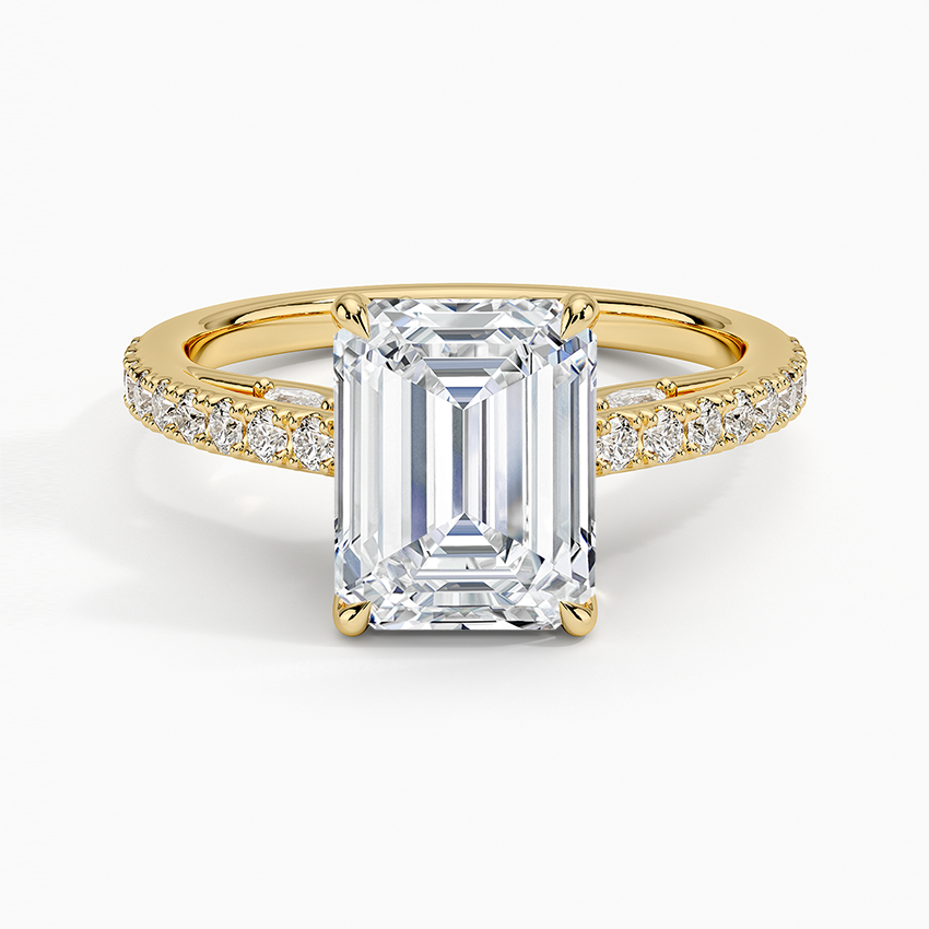 Emerald cut moissanite with pave shoulders and marquise accents in yellow gold, top view