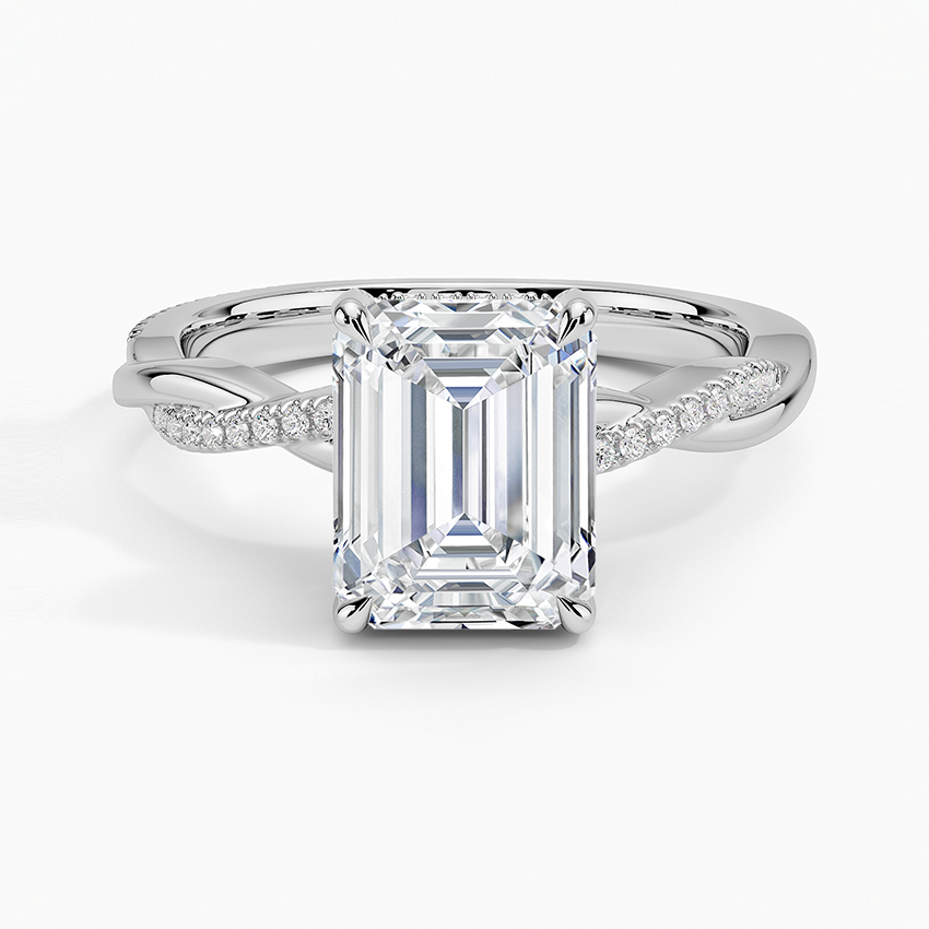 Emerald cut moissanite with hidden halo on a twisted pave vine band in white gold, top view