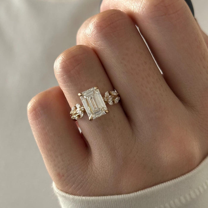 Emerald cut moissanite nature inspired vine engagement ring with hidden halo in yellow gold, view 2