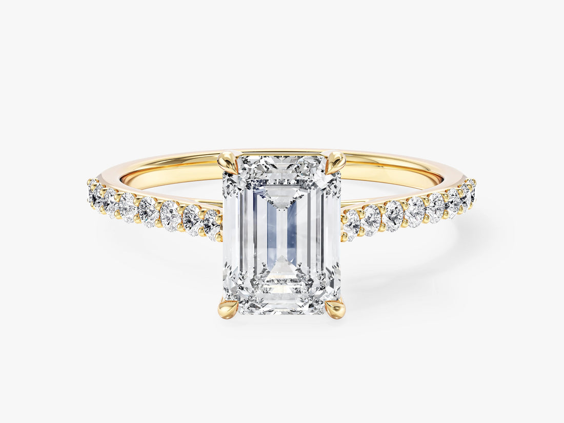 Emerald cut lab grown diamond engagement ring with pave shoulders in yellow gold, front view