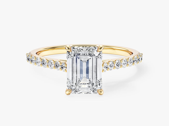 Emerald cut lab grown diamond engagement ring with pave shoulders in yellow gold, front view