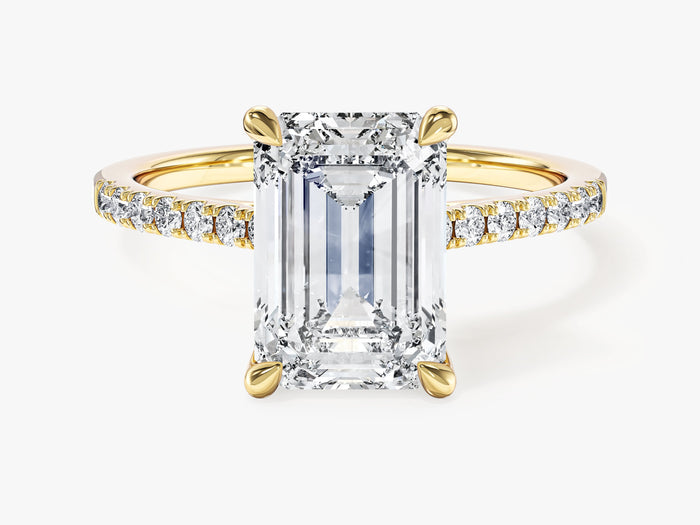Large emerald cut lab grown diamond statement engagement ring with pave band in yellow gold, front view