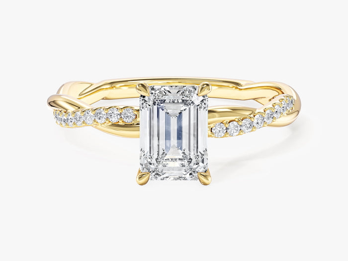 Emerald cut lab grown diamond infinity twist engagement ring in yellow gold with a half pave strand, front view