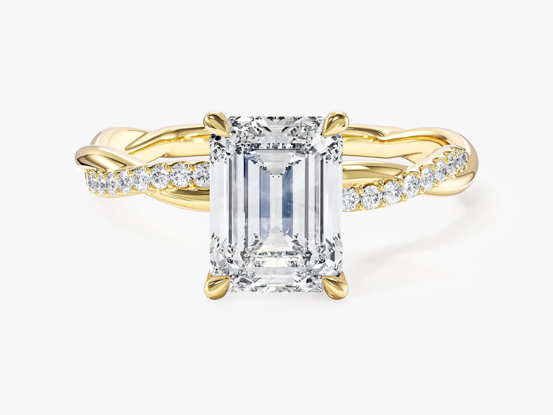 Emerald cut lab grown diamond four claw engagement ring with braided pave band in yellow gold, front view