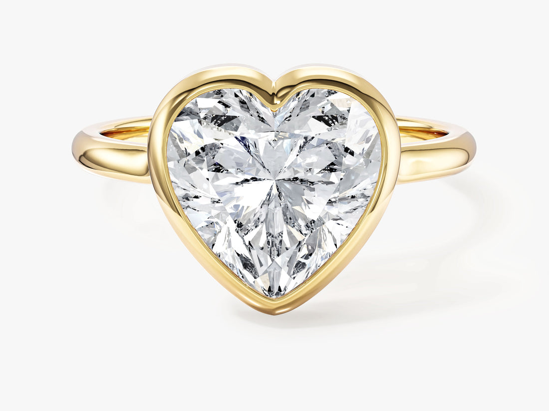 Bold heart lab grown diamond bezel statement engagement ring in yellow gold, front view