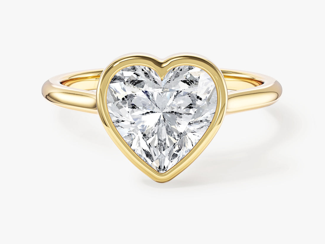 Heart shaped moissanite full bezel engagement ring in yellow gold, front view