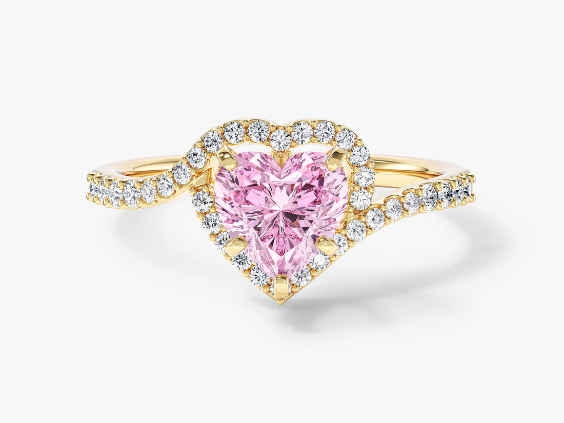 Heart moissanite halo engagement ring with swirl bypass pave band in 14K yellow gold, pink display stone