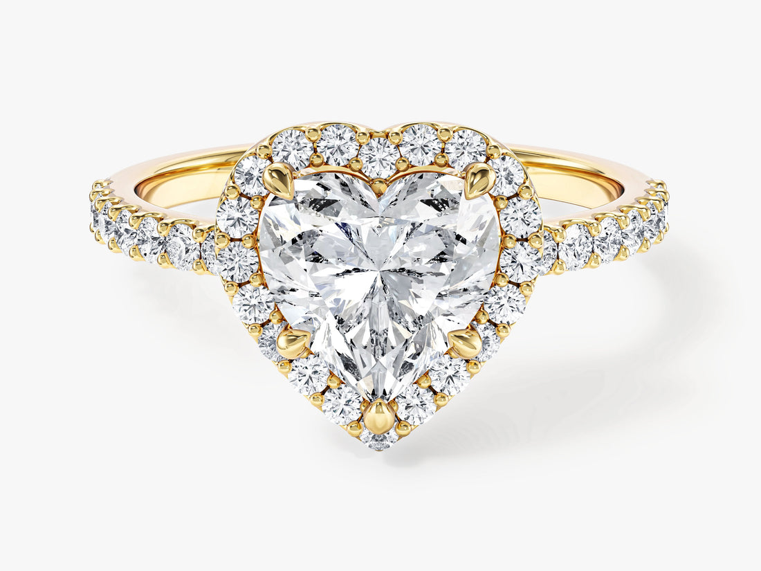 Heart cut moissanite halo engagement ring with pave shoulders in 14K yellow gold, front view