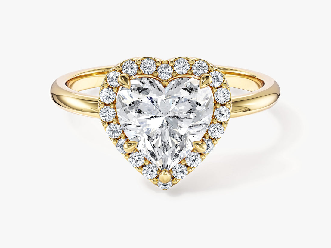 Heart cut moissanite micro prong halo engagement ring in yellow gold, front view