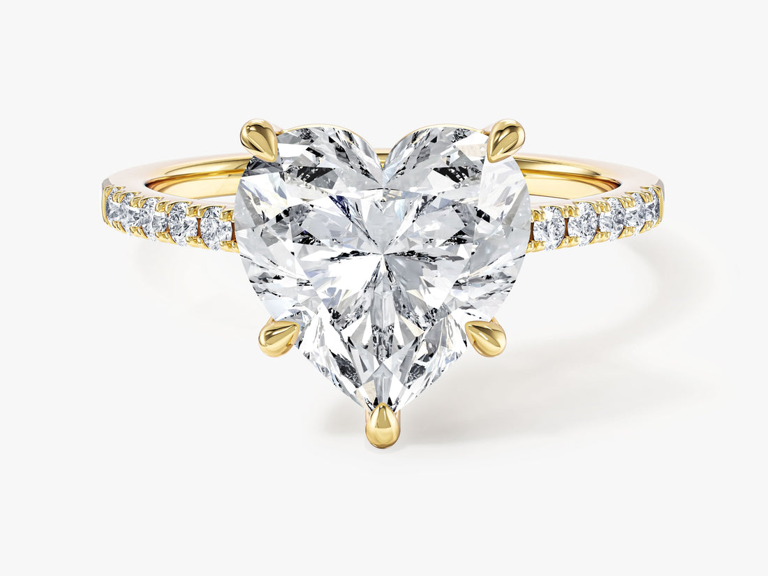Large heart lab grown diamond engagement ring with pave shoulders in yellow gold, front view with five claws