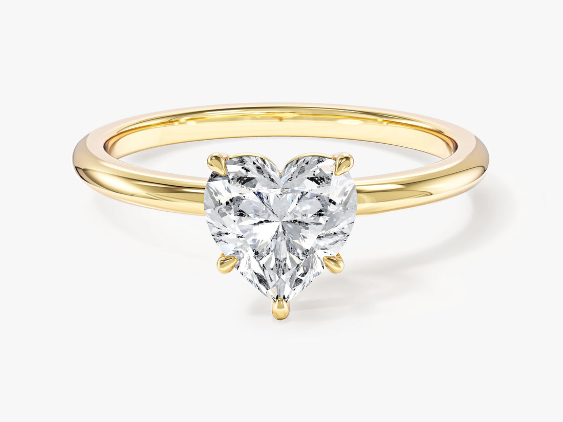 Heart shaped moissanite solitaire engagement ring with five claws in 14K yellow gold, front view