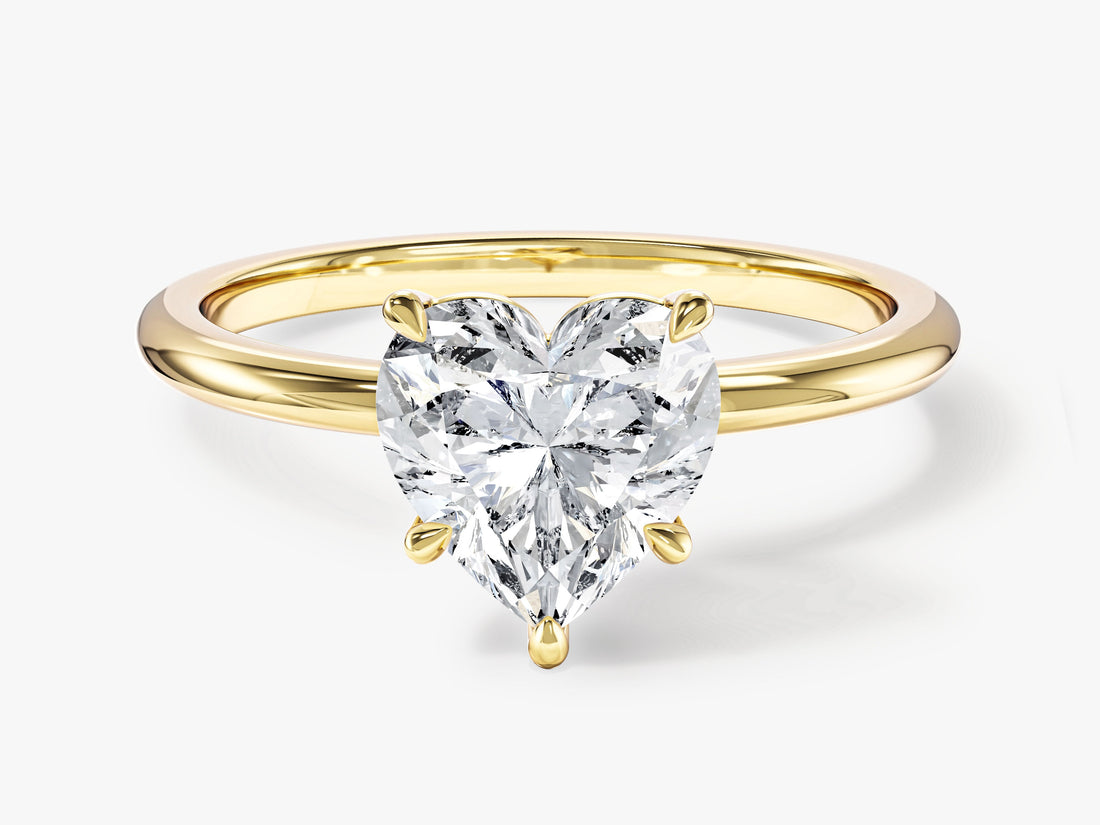 Heart cut moissanite thin band solitaire engagement ring in 14K yellow gold, front view