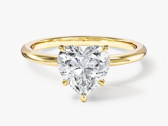 Heart cut moissanite thin band solitaire engagement ring in 14K yellow gold, front view