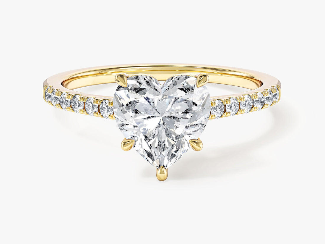 Heart shaped moissanite engagement ring with pave set shoulders in 14K yellow gold, front view