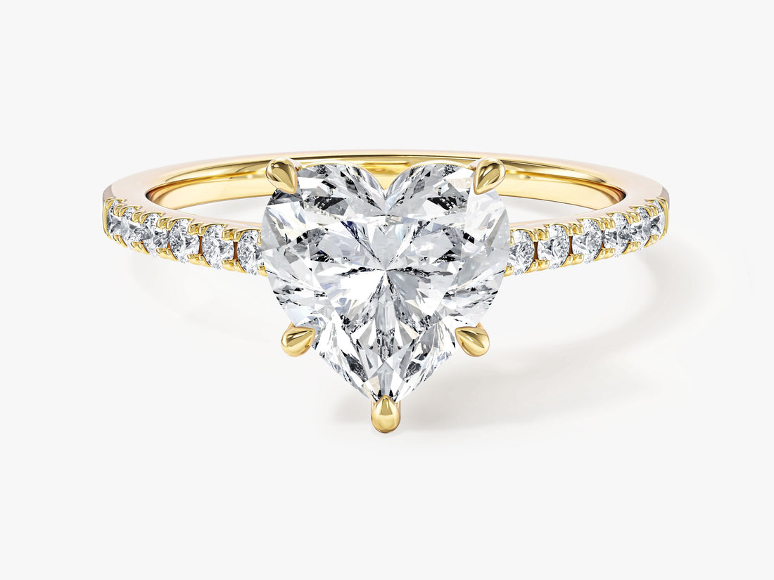 Heart moissanite accented solitaire engagement ring with pave band in 14K yellow gold, front view