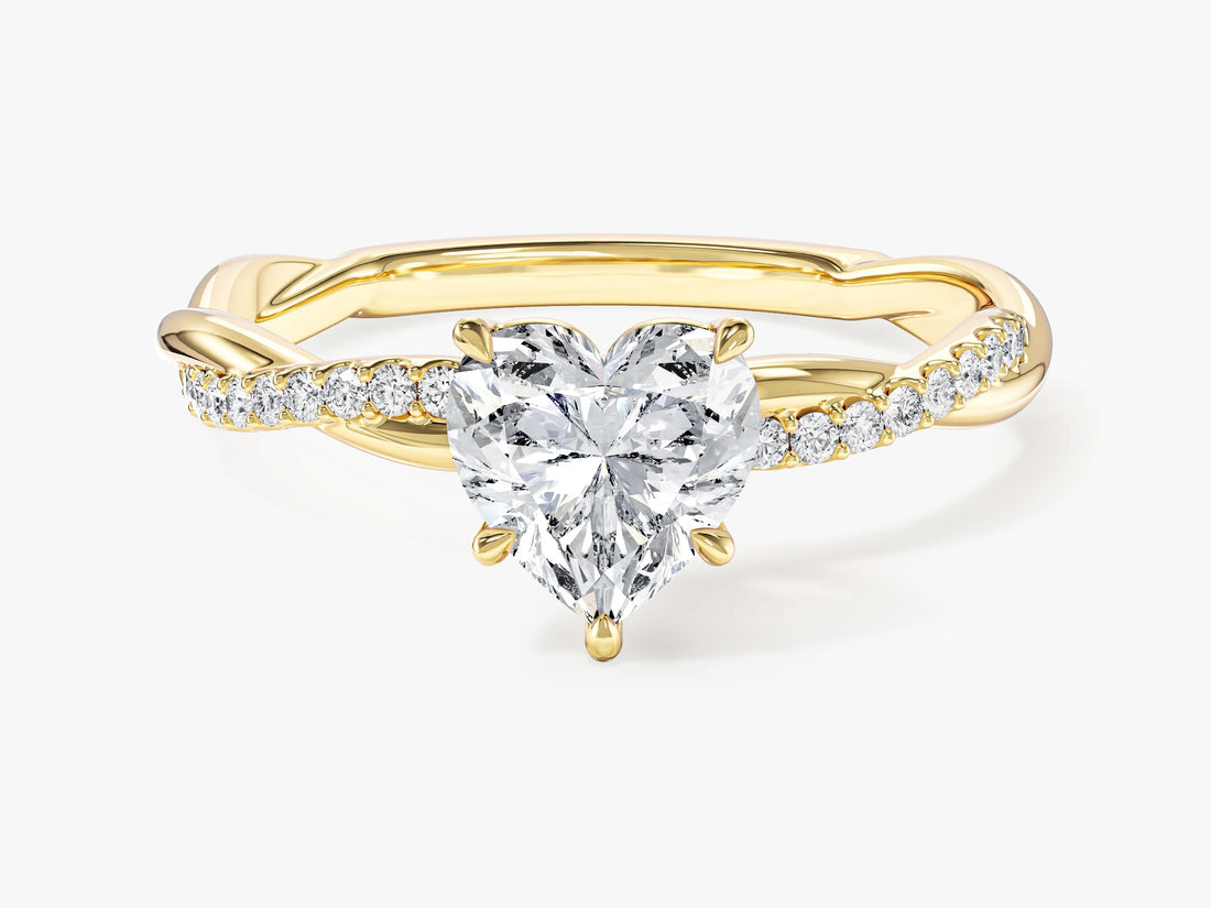 Heart shaped moissanite engagement ring with twisted pave band in yellow gold, front view