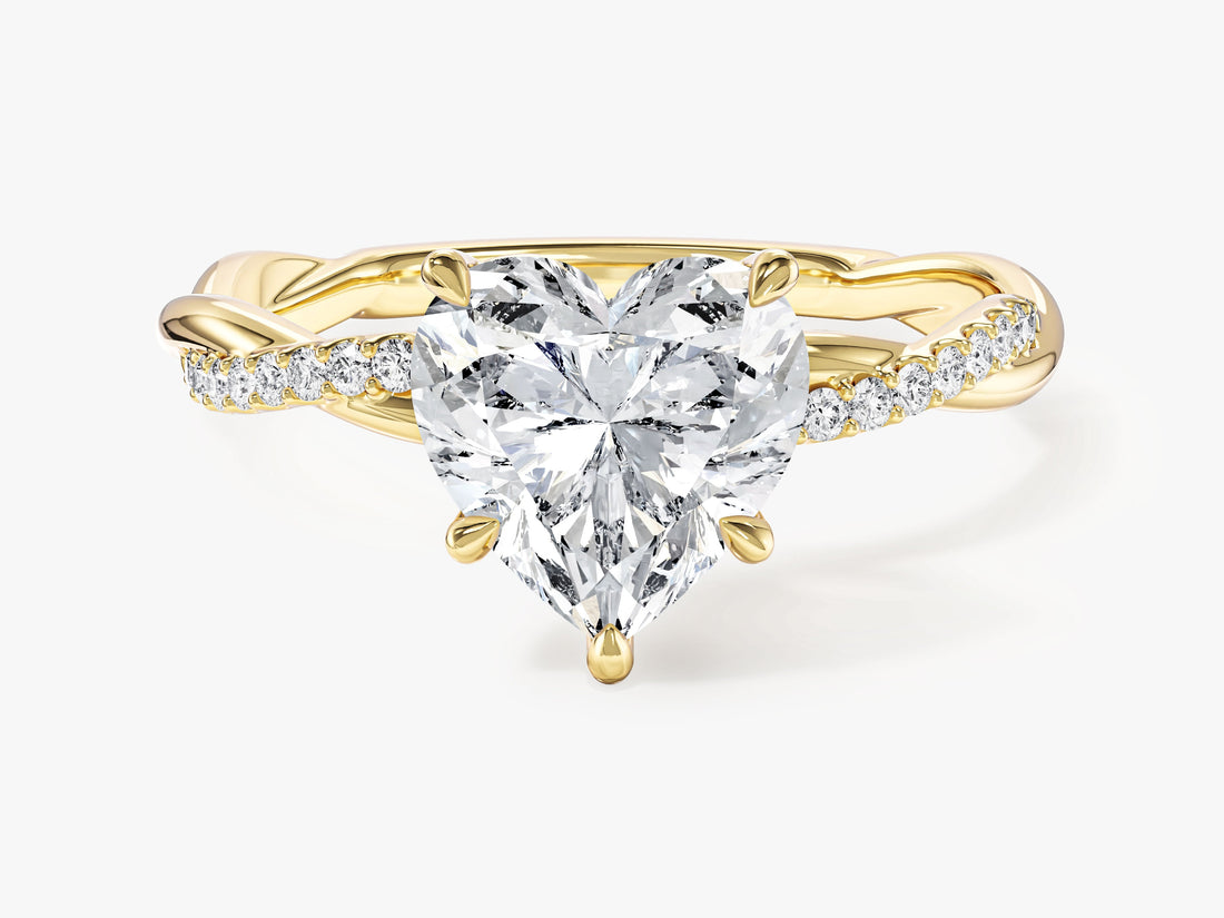 Heart moissanite engagement ring with intertwined micro pave band in yellow gold, front view