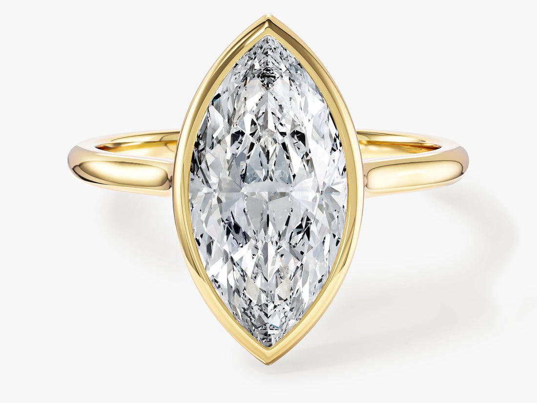 Large marquise lab grown diamond bezel statement engagement ring in yellow gold, front view