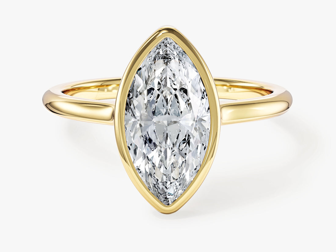 Marquise cut moissanite bezel set engagement ring in yellow gold, front view
