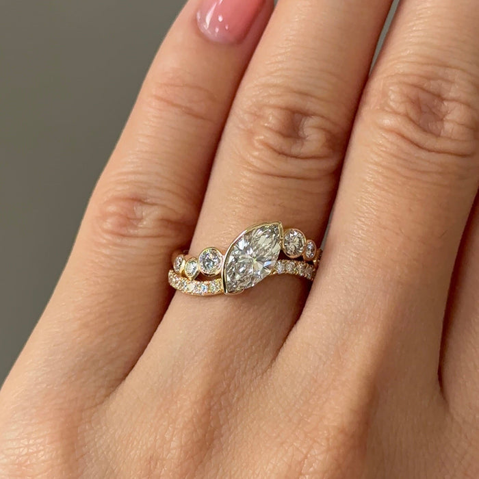 East west marquise moissanite curved pave engagement ring in yellow gold, view 2
