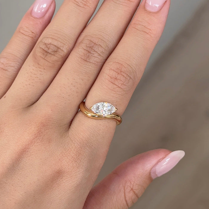 East west marquise moissanite curved band solitaire engagement ring in yellow gold, view 2