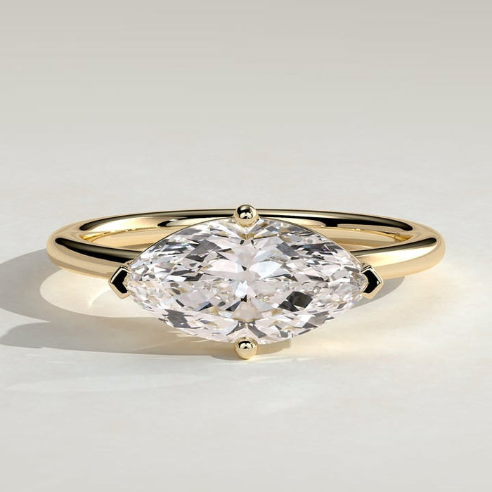 East west marquise moissanite solitaire engagement ring on a fine plain yellow gold band