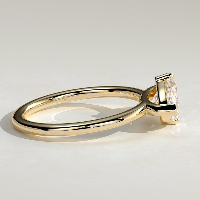 East west marquise moissanite solitaire engagement ring on a fine plain yellow gold band, view 2