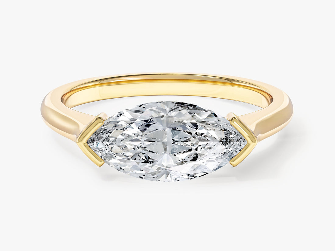 East west marquise moissanite solitaire engagement ring with V tip setting in yellow gold, front view