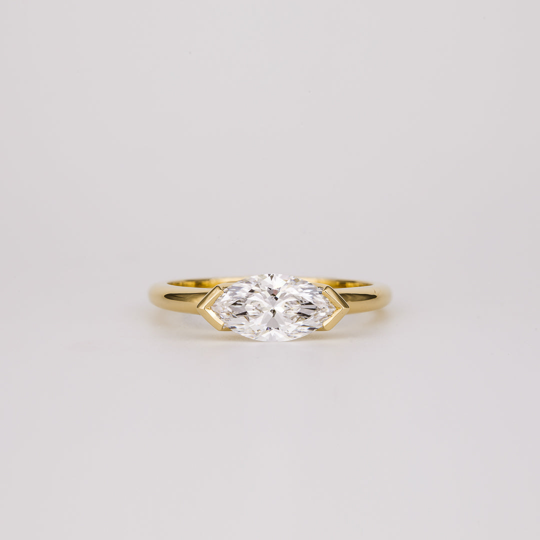 East west marquise moissanite geometric half bezel engagement ring in yellow gold