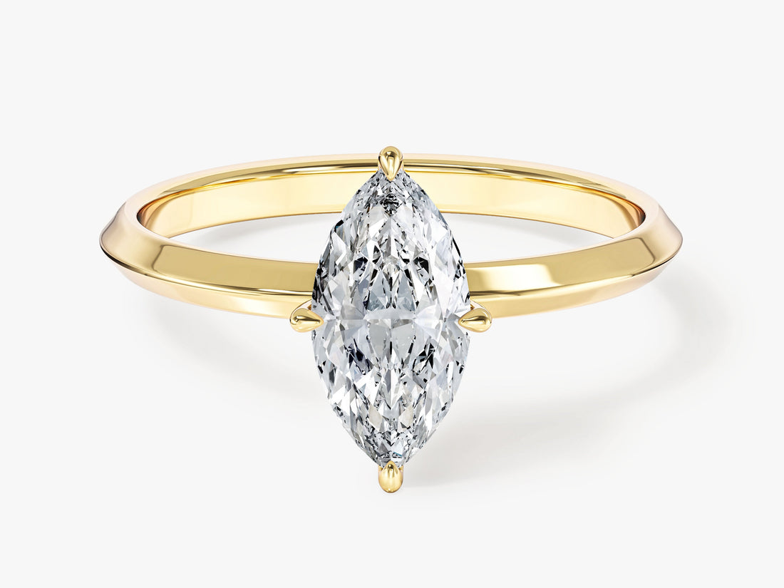 Dainty marquise lab grown diamond navette ring on a knife edge shank in yellow gold, front view