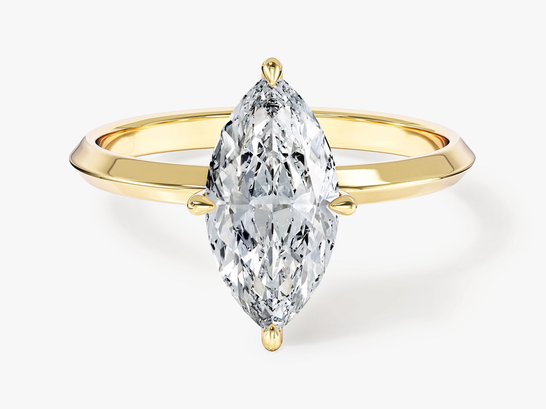 Marquise cut moissanite knife edge solitaire engagement ring in 14K yellow gold, front view